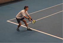 Captain of Tennis Luca Bland serving
