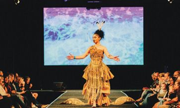 A model wearing Arvin Rafiee's design on stage